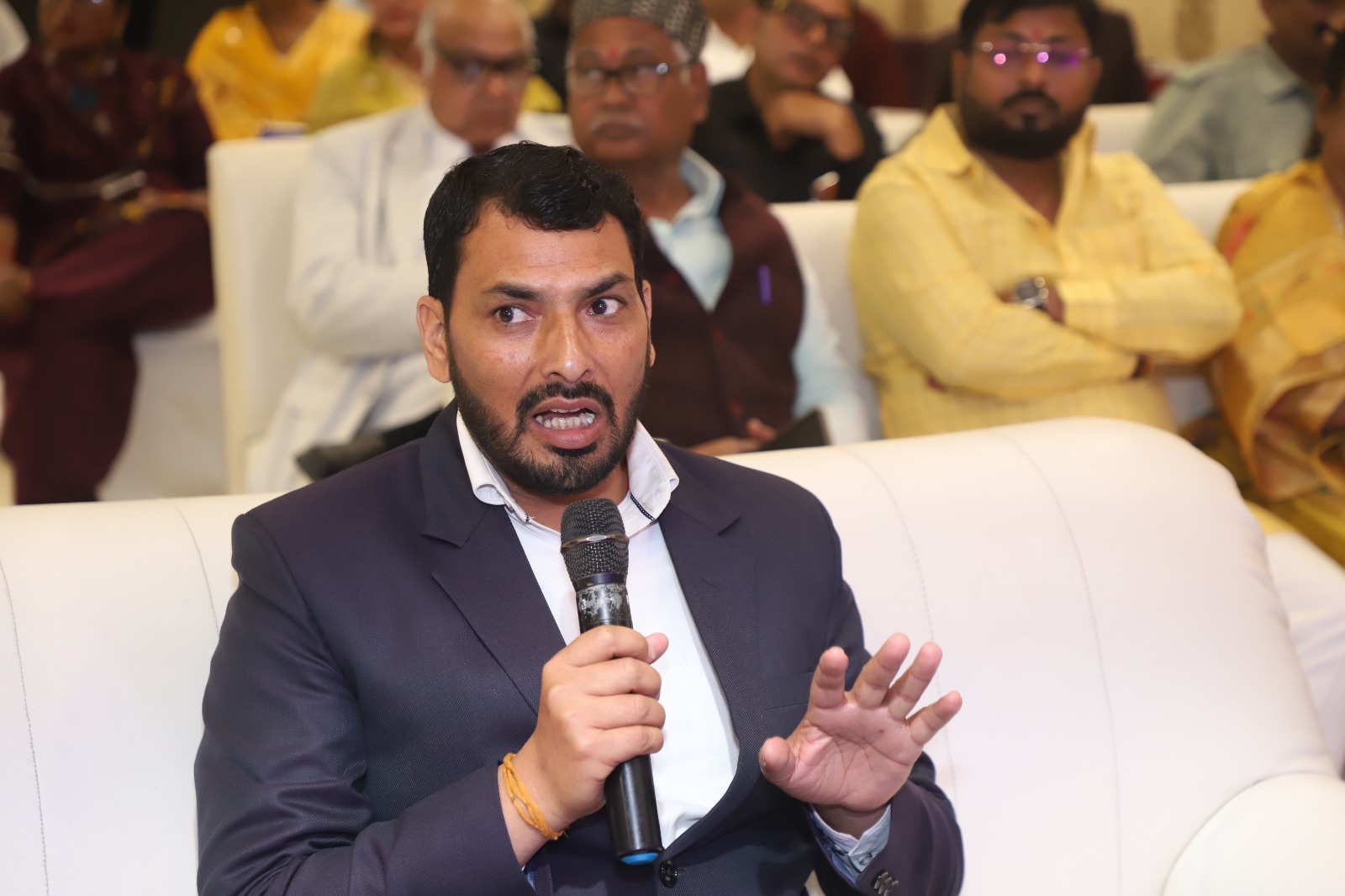 Dr. Sharma speaking with community members at the grassroots level